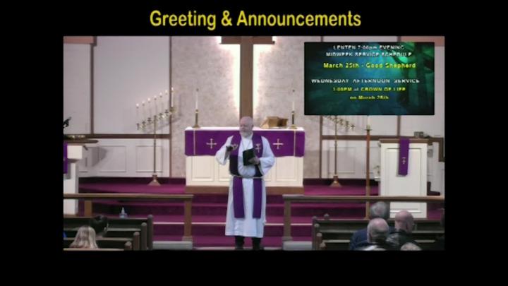 A pastor standing center frame with the text Greetings above written in yellow. 