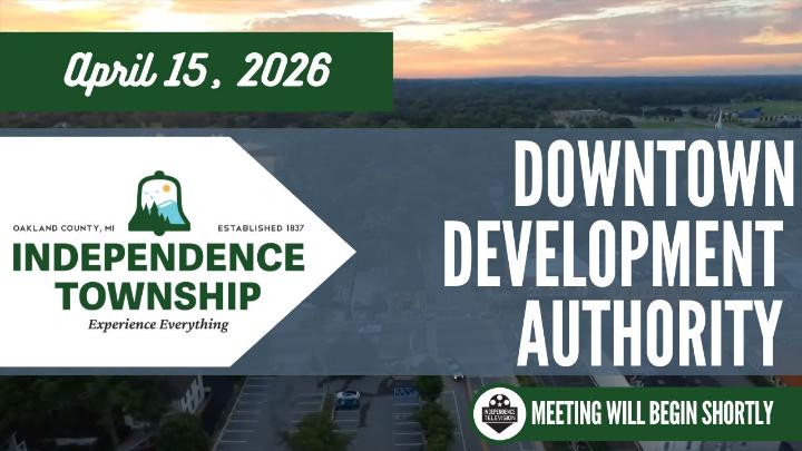The Independence Township logo to the left of the screen with the text of April 15, 2026 above the logo. Downtown Development Authority is written center frame with the Independence Television logo below with text stating, "The Meeting will Begin Soon." The background image is a drone shot of Pine Knob Ski Hill with the sun setting. 