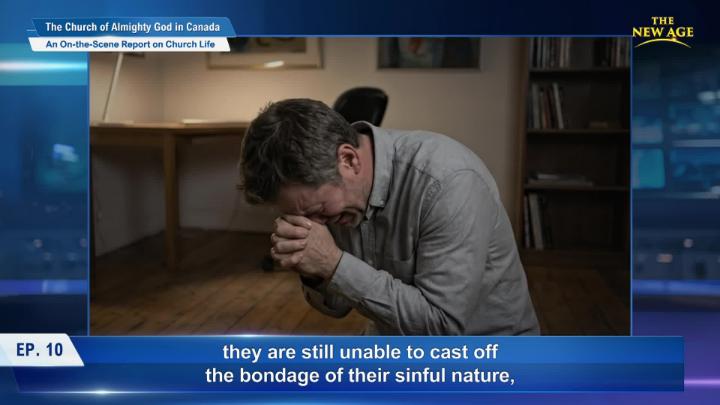 A man, center frame, praying with a blue box acting as a background. 