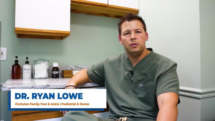 Doctor in office being interviewed 
